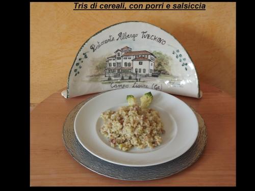 a plate of food on a table with a plate of food at Albergo Ristorante Turchino in Campo Ligure