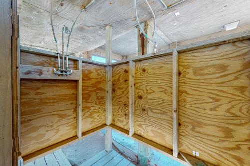 a room with wooden walls in a home under construction at Windy Dunes 138 in Avon