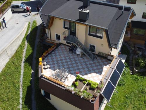 an overhead view of a house with a patio at Holiday Home Bergblick by Interhome in Kappl
