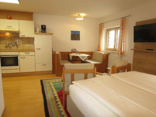 a room with a kitchen and a living room at Apartment Hof am Schönbach - STA163 by Interhome in Sankt Jakob