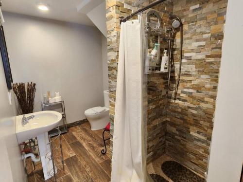 a bathroom with a shower and a sink at White Mountain Vista! in Lincoln
