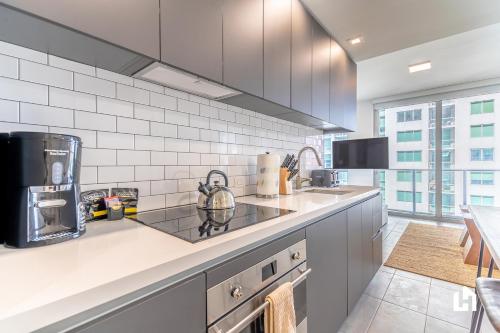 a kitchen with a sink and a counter top at Downtown Miami Condos by Lua Host in Miami