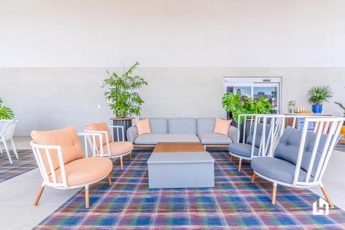 a living room with a couch and chairs at Downtown Miami Condos by Lua Host in Miami