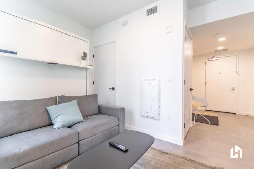 a living room with a couch and a table at Downtown Miami Condos by Lua Host in Miami
