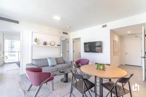 a living room with a couch and a table at Downtown Miami Condos by Lua Host in Miami