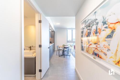 a hallway with a large painting on the wall at Downtown Miami Condos by Lua Host in Miami