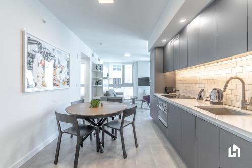 a kitchen with a table and chairs in a room at Downtown Miami Condos by Lua Host in Miami