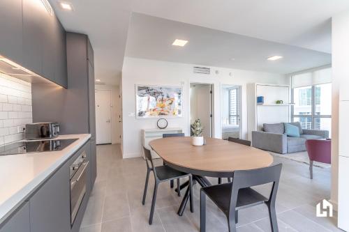 a kitchen and living room with a table and chairs at Downtown Miami Condos by Lua Host in Miami