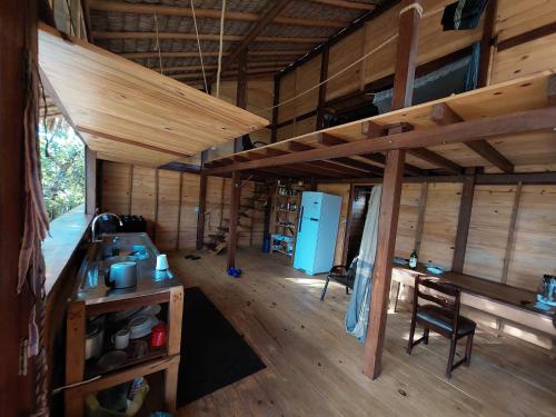 an inside view of a cabin with wooden walls and ceilings at Casa de Atins in Atins