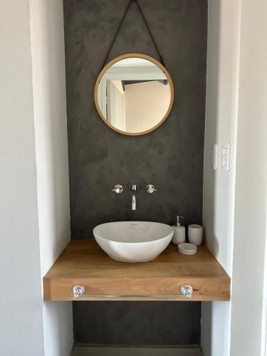 a bathroom with a white sink and a mirror at Departamento Privado En La Ruta Del Vino in Maipú