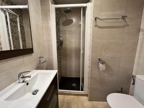 a bathroom with a sink and a shower at El Cielo De Mogarraz in Mogarraz