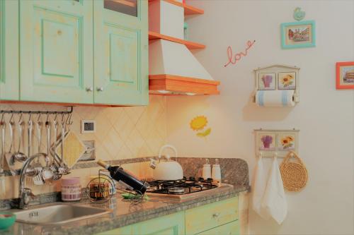 a kitchen with a sink and a stove top oven at The Best Nest in Rome