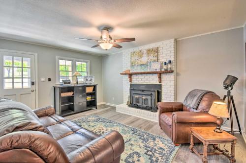 a living room with two couches and a fireplace at Georgia Getaway with 2-Story Dock By Lake Hartwell in Hartwell