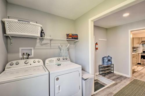a laundry room with a washer and dryer at Georgia Getaway with 2-Story Dock By Lake Hartwell in Hartwell