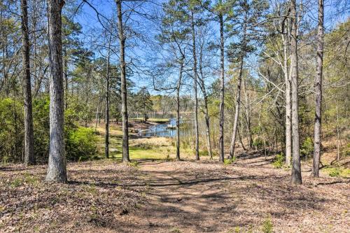 a wooded area with trees and a body of water at Georgia Getaway with 2-Story Dock By Lake Hartwell in Hartwell