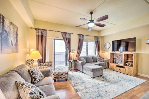 a living room with a couch and a tv at 3 Mi to Sugar Mtn Resort! Family Escape with Balcony in Sugar Mountain