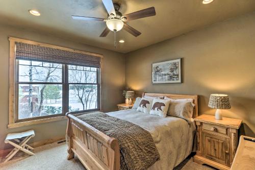 a bedroom with a bed and a ceiling fan at Beautiful Eureka Cabin Rental on Golf Resort! in Eureka