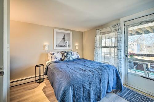 a bedroom with a bed and a large window at Lovely Rockport Apartment, Walk to Beaches! in Rockport