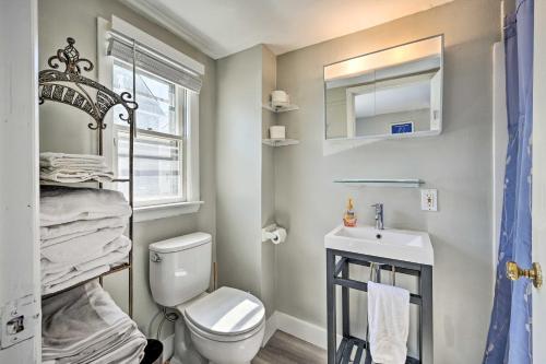 a small bathroom with a toilet and a sink at Lovely Rockport Apartment, Walk to Beaches! in Rockport