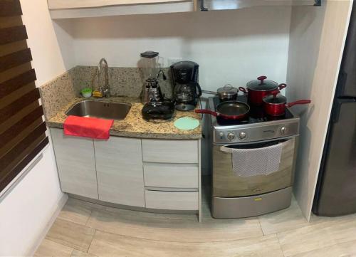 Η κουζίνα ή μικρή κουζίνα στο Cozy Suite Cuenca