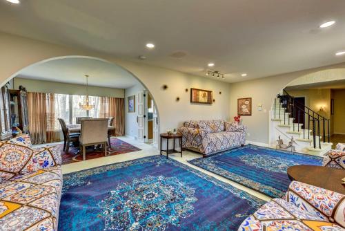 a living room with a couch and a table at Spacious Buffalo Brick Home w/ Backyard! in Buffalo