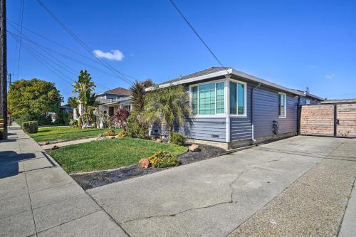 a house with a driveway and a yard at Cozy Bay Area Vacation Rental with Patio in Hayward