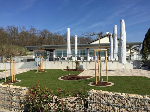 a playground in front of a building with columns at Köpfers Steinbuck in Bischoffingen