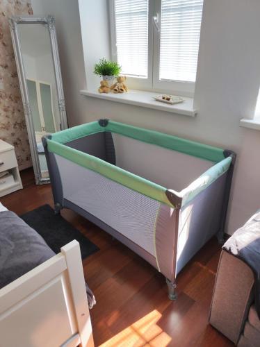 a bed in a room with a mirror at UBYTOVÁNÍ NA SPRÁVNÉM MÍSTĚ in Znojmo