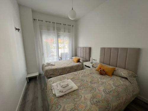 Posteľ alebo postele v izbe v ubytovaní Villa Bobita-Marina Golf-Playa Granada