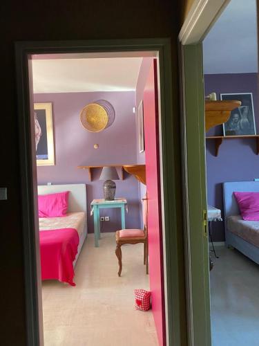 a bedroom with a bed and a room with a couch at Villa-Agave , by the sea in Porto-Rafti outside Athens in Porto Rafti