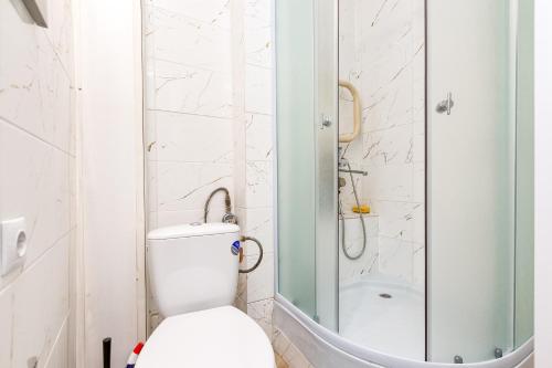 a bathroom with a toilet and a shower at Dubnas iela - 6 can stay in Rīga