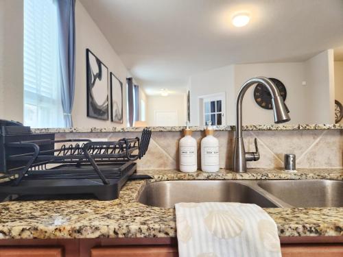 a kitchen counter top with a sink and a sink at Skyview Stays by ION Rentals near Downtown Med Center NRG Stadium Pearland in Houston