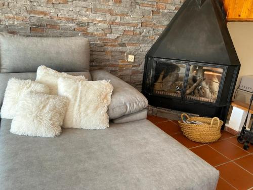 a living room with a couch and a fireplace at Arrayanes Royal in Sierra Nevada