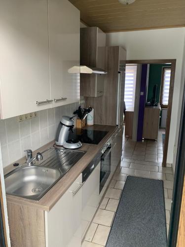 a kitchen with a sink and a counter top at Sigis Fewo - Monteurwohnung in Erbendorf