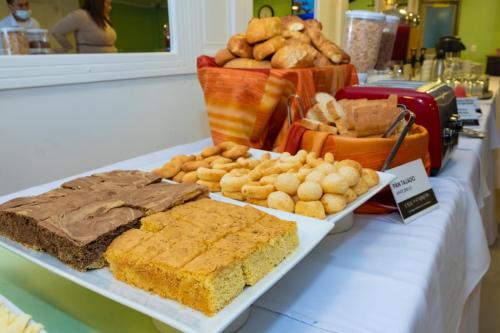 a buffet of bread and pastries on a table at Hotel Virrey Central in Bogotá