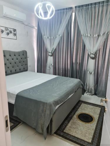 Tempat tidur dalam kamar di Reem Suite