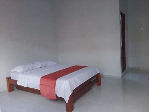 Postel nebo postele na pokoji v ubytování Hotel Distracción Guajira
