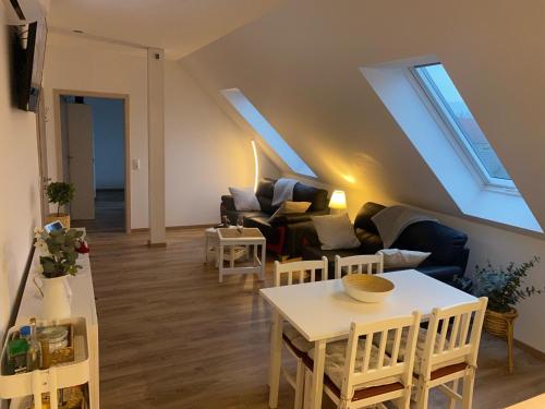 a living room with a couch and a table at FEWO Salzwedel, Zum Dorfplatz in Salzwedel