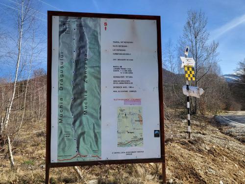 a large sign on the side of a road at Pensiunea ANA Vistisoara in Vistisoara