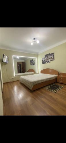 Łóżko lub łóżka w pokoju w obiekcie Tiraspol Apartament