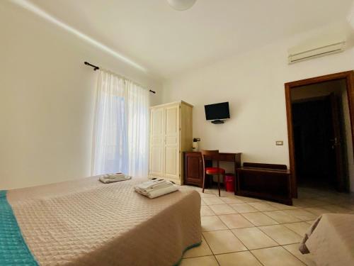 Łóżko lub łóżka w pokoju w obiekcie Mamamia #Lipari