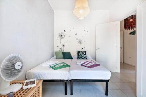 A bed or beds in a room at Cozy Flat and Terrace - 2 min from the beach by Sweet Home Puglia Apartments