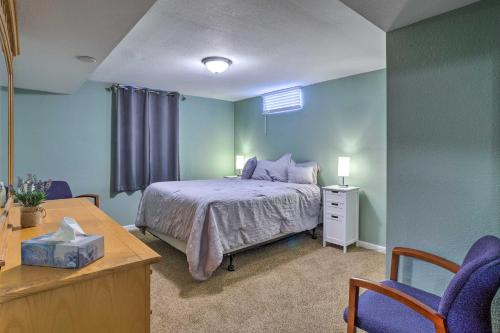 a bedroom with a bed and a table and chairs at Shared Patio and Fire Pit Denver Apartment in Denver