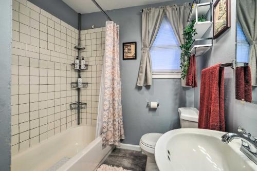 a bathroom with a tub and a toilet and a sink at Spacious Fort Washington Home Near National Mall! in Fort Washington