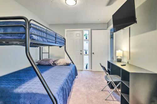 a bedroom with a bunk bed and a desk at Spacious Fort Washington Home Near National Mall! in Fort Washington