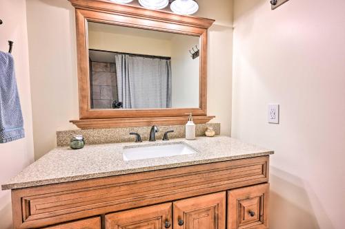 a bathroom with a sink and a mirror at Lakefront Hartland Cottage with Patio and Fire Pits! in Hartland