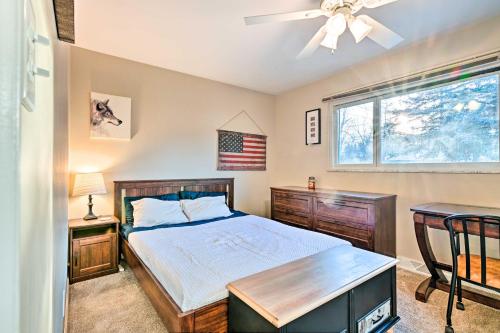 a bedroom with a bed and a window at Lakefront Hartland Cottage with Patio and Fire Pits! in Hartland