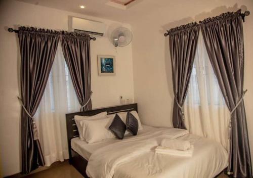 Postel nebo postele na pokoji v ubytování Hope Residence Hotel and Suites