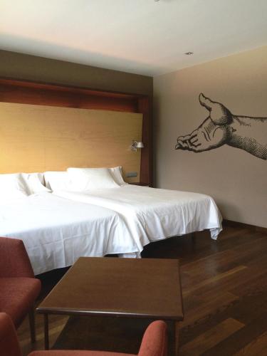 Postel nebo postele na pokoji v ubytování SOMMOS Hotel Aneto