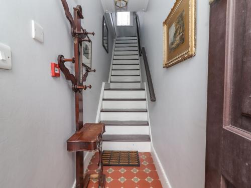a stairway with a set of stairs in a house at The Merchant's House in Kilrush